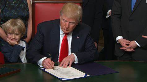 President Donald Trump signs first US crypto regulatory bill into law