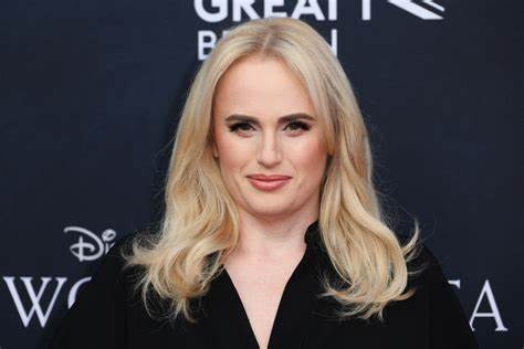Rebel Wilson wows in purple strapless gown at TIFF premiere of her directorial debut The Deb amid legal battle with the film's producers