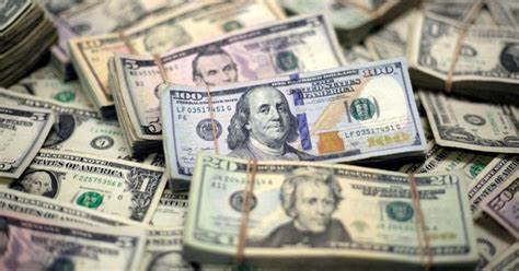 Dollar drops as Fed cuts rates, traders unwind some Trump trades - Reuters