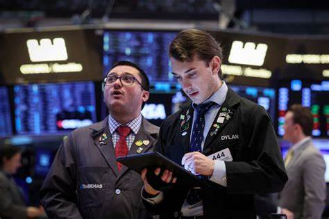 Stocks slide as even more companies pull their forecasts and Wall Street eyes the Fed