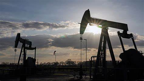 Profits at American oil giants Exxon Mobil and Chevron fall in tandem with waning energy demand